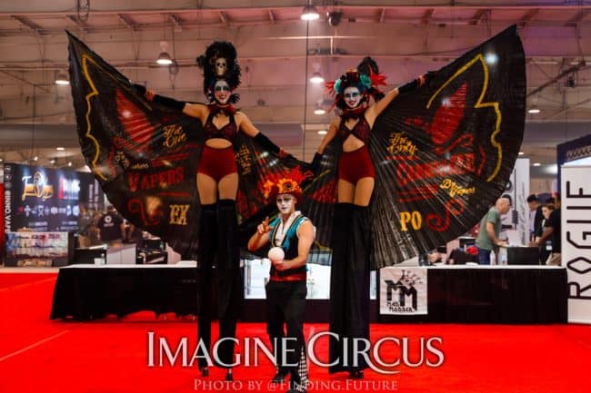 Dark Circus, Stilt Walkers, Juggler, Liz Kaci and Adam, Logo Branded Wings, Vapers Carnivale, Imagine Circus Performers, Photo by Finding Future